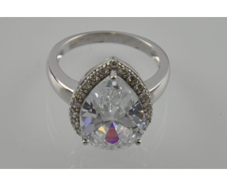 A silver and large teardrop shaped cubic zirconia ring