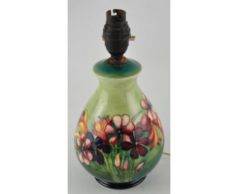 A Moorcroft Spring Flowers pattern baluster table lamp with mottled green glazed body, h:19cm