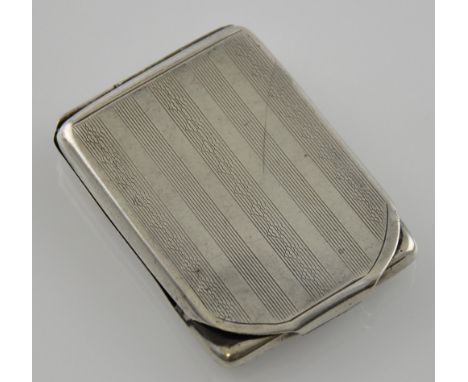 A George V rectangular silver matchbook holder with engine turned decoration, Cohen & Charles, Birmingham 1924