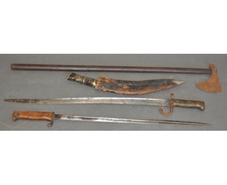Two early 20th century bayonets, one marked WK & S Solingen, together with a Persian iron head axe and a horn handled kukri