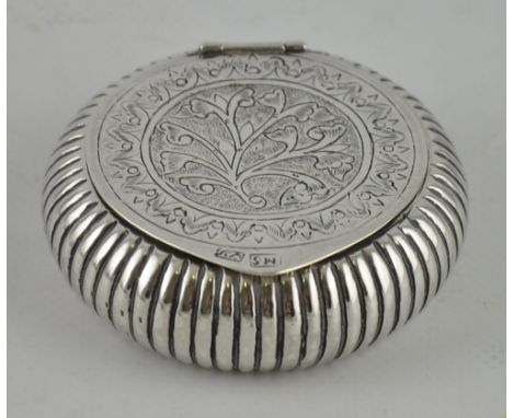 A 19th century Persian silver snuff box with all over engraved decoration, c.1850, hallmarked to the lid, D8cm, 70grams