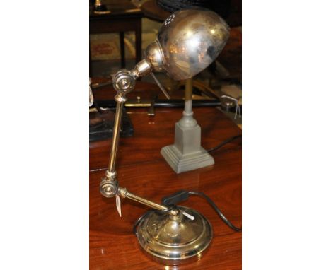 A designer chrome plated anglepoise lamp
