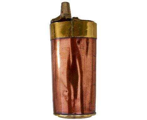 tapering copper body with threaded base cup, pivoting ball trap and sprung nozzle to the top.