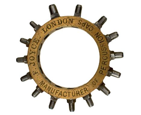 the circular brass body stamped F. JOYCE LONDON MANUFACTURER OF PERCUSSION CAPS, the outside set with fifteen nipple blanks f