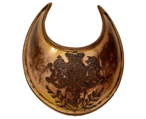 the copper gilt body with turned rim, the arms pierced for a silk tie, the front engraved with the crowned Royal Arms surmoun