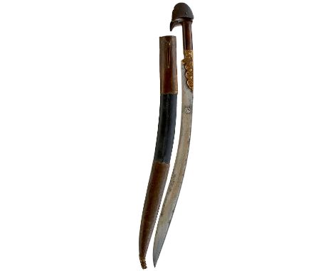 61cm sharply curved fullered blade decorated with a partial panel of script and a star form in silver, foliate embossed brass