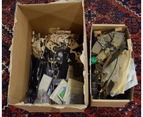 Two boxes of mainly double bass and violoncello fittings, including bridges, end pins, tailpieces, strings and brass faced tu