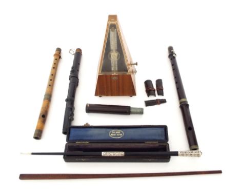 Ebonised and silver collared two piece conductor's baton, the case branded 'The Handy Pocket Baton'; together with a pyramid 