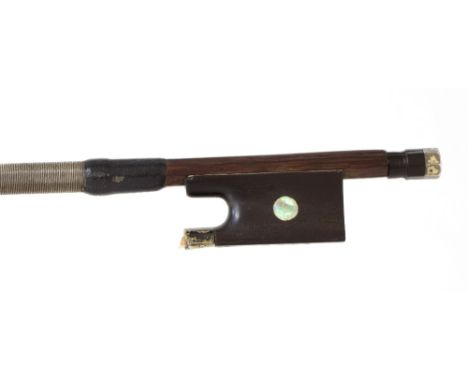 Interesting silver mounted violin bow stamped Tourte, the stick round, the ebony frog inlaid with pearl eyes and with a damag