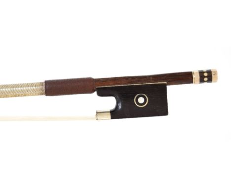 Silver mounted violin bow, unstamped, the stick round, the ebony frog inlaid with silver rings enclosing pearl eyes and the e