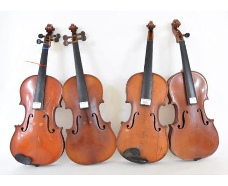 Four various early 20th century French trade full size violins labelled: J.T.L., Mirecourt 1894, Copie de Antonio Stradivariu