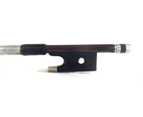 French nickel mounted violin bow by and stamped C. Buthod á Paris, the stick round, the ebony frog inlaid with pearl eyes and