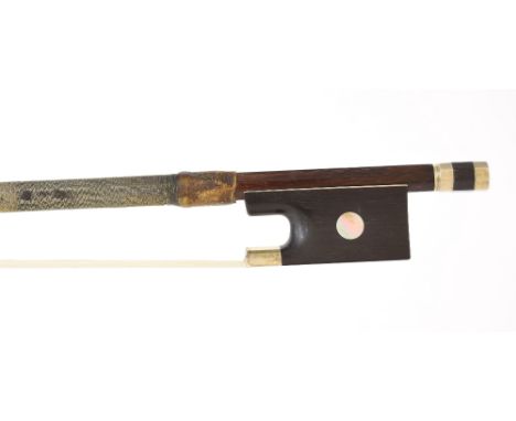 Interesting silver mounted violin bow, unstamped, the stick octagonal, the ebony frog inlaid with large pearl eyes and the eb