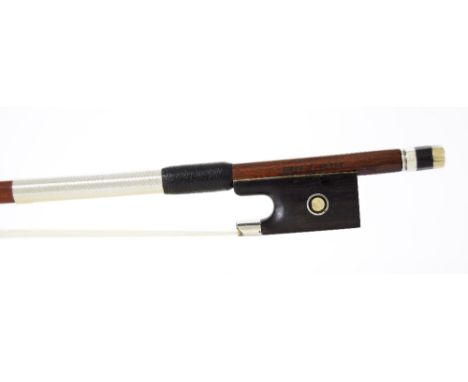 Silver mounted violin bow stamped A. Lamy á Paris, the stick round, the ebony frog inlaid with silver rings enclosing pearl e