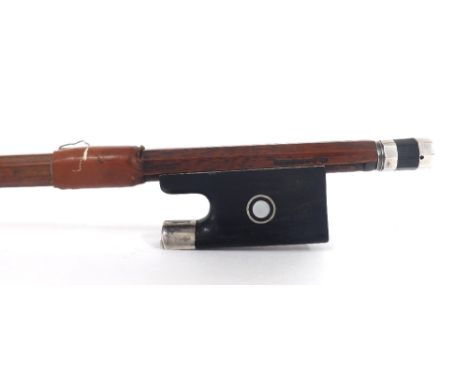 Silver mounted violin bow stamped M. Lapierre, the stick octagonal, the ebony frog inlaid with silver rings enclosing pearl e