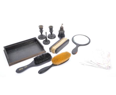 A vintage 20th century circa 1930 1940s Ebony dressing room vanity set with tray, candlesticks (2) hand mirror, brushes (clot