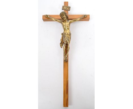 A large 20th century brass wall mounted crucifix set upon an inlaid oak wooden cross. With brass plaque marked 'IMRI'. Measur