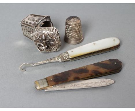 A MID VICTORIAN SILVER THIMBLE HOLDER, maker's mark AD., London 1872, of flared square section with stamped and applied panel