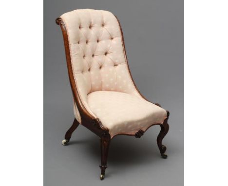 A VICTORIAN WALNUT SALON CHAIR of Grecian design, button upholstered in a pale pink and ivory weave, serpentine scroll carved