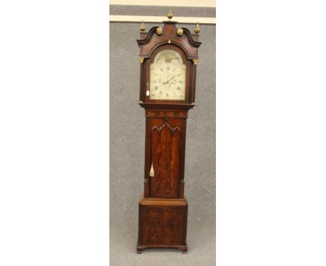 A MAHOGANY LONGCASE signed J Holland, Bury, the eight day movement with anchor escapement striking on a bell, 12" arched dial