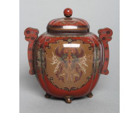 A JAPANESE CLOISONNE ENAMEL VASE AND COVER of lobed oval section, with two applied stylised handles, inlaid in sombre colours