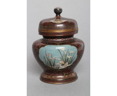 A JAPANESE NAGOYA CLOISONNE ENAMEL VASE AND COVER of squat baluster form, inlaid in sombre colours with flowering prunus and 