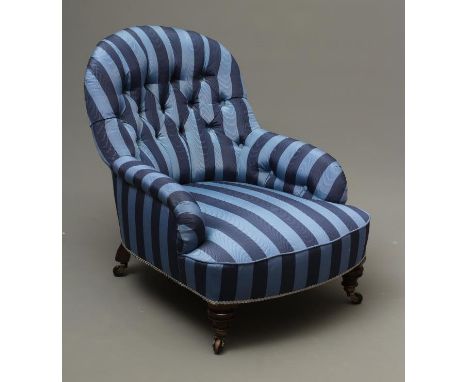 A VICTORIAN WALNUT AND IRON FRAMED ARMCHAIR button upholstered in blue striped watered silk, arched back, raised on turned ta