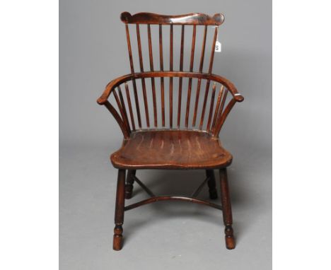 A GEORGIAN COMB BACK WINDSOR ARMCHAIR, Thames Valley, c.1800, in ash and elm, the shaped comb rail with scroll ends, crook ar