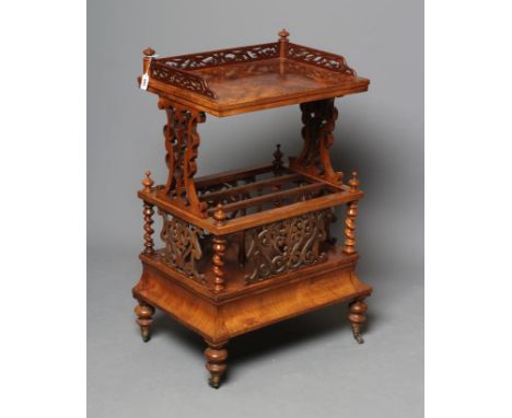 A VICTORIAN BURR WALNUT TWO STAGE CANTERBURY of oblong form, the upper shelf with pierced three quarter gallery surmount on p