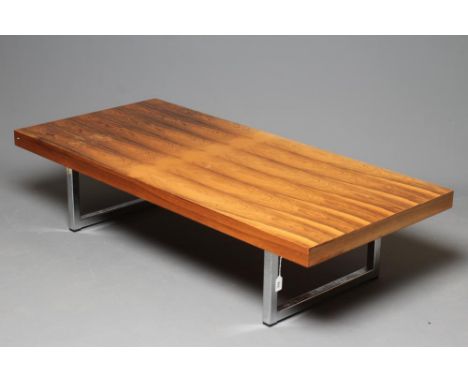 A ROSEWOOD VENEERED AND POLISHED STEEL(?) COFFEE TABLE, mid 20th century, the oblong top raised on open continuous square sec