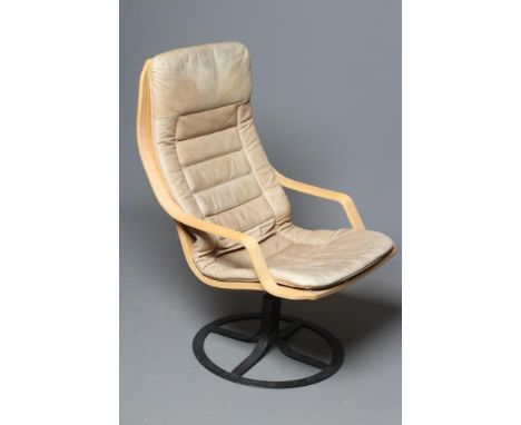 A SWEDISH BENTWOOD ARMCHAIR, mid 20th century, the canvas seat with button-on caramel leather(?) cushions, raised on circular