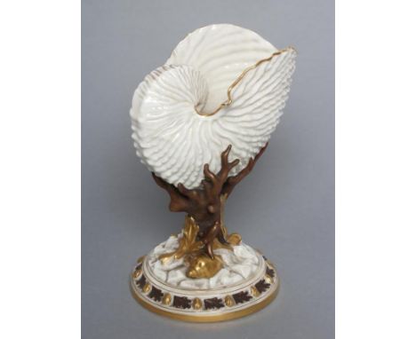 A LATE VICTORIAN ROYAL WORCESTER CHINA NAUTILUS SHELL VASE raised upon bronzed and gilded coral and shells on a naturalistica