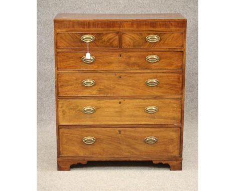 A GEORGIAN MAHOGANY STRAIGHT FRONTED TALL CHEST, c.1800, the caddy top over a banded frieze with stringing, two short over fo