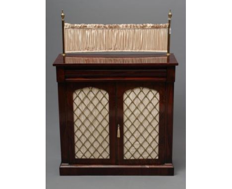 A VICTORIAN ROSEWOOD CHIFFONIER of shallow oblong form, the moulded edged top with brass rail and curtain, cushion moulded fr