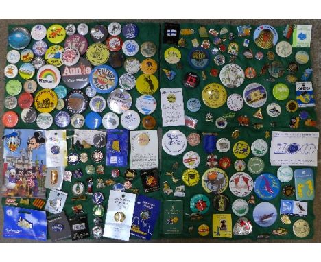 A large collection of enamel and pin badges