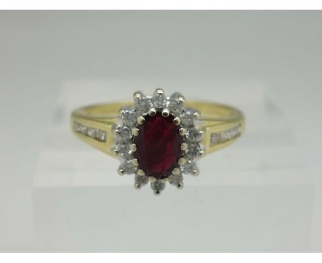 An 18ct gold, ruby and diamond cluster ring, 0.33ct diamond weight, weight 4g, size M