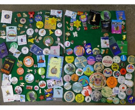 A large collection of enamel and pin badges