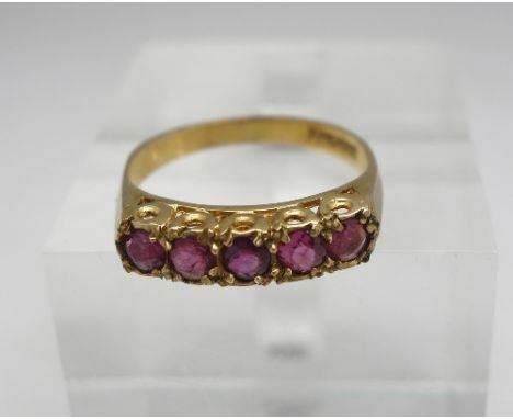 A 9ct gold and five stone ruby ring, weight 2.4g, size M