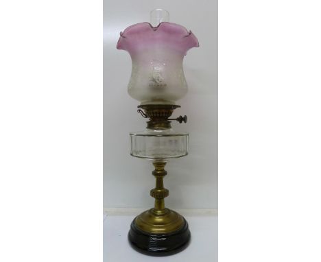 A brass and glass oil lamp