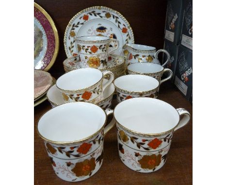 A Royal Crown Derby six setting coffee set, lacking one tea plate