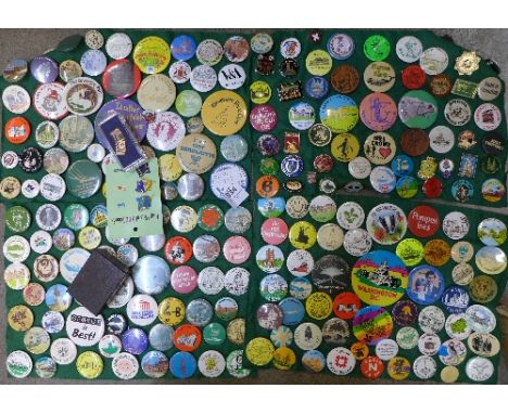 A large collection of enamel and pin badges