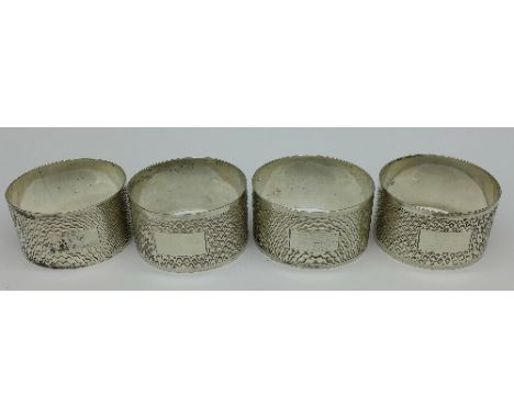 A set of four silver engine turned napkin rings