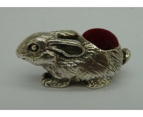 A miniature silver novelty pin cushion in the form of a rabbit, marked .925