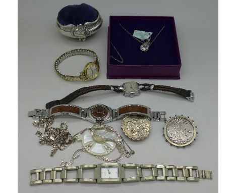 Two Victorian brooches, four lady's wristwatches, including Swatch and Tissot, a mother of pearl pendant, a Swarovski crystal