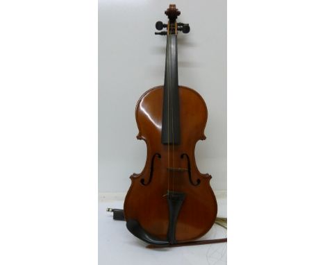 A cased violin, with paper label, copie de Antonius Stradivarius, Cremonenzis, J.T. Dann, Nottingham, 1909