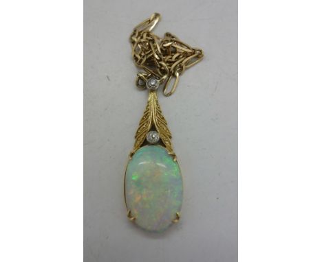 An opal and diamond pendant and yellow metal chain, chain a/f, weight 3.5g, height of opal 16mm