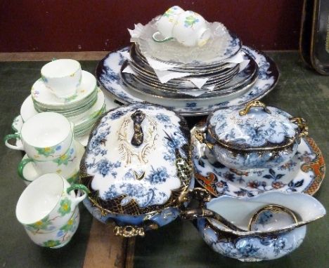 Flow Blue Flanders pattern dinnerware comprising two tureens, sauce boat, meat plate and twelve other plates, a Paragon china