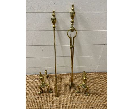 A brass fire tools and fire dogs 