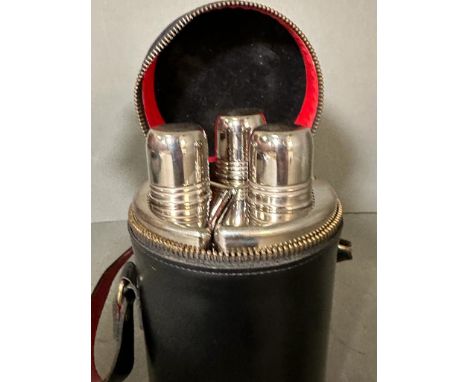 Three glass and chrome flask set in real hide carry case.