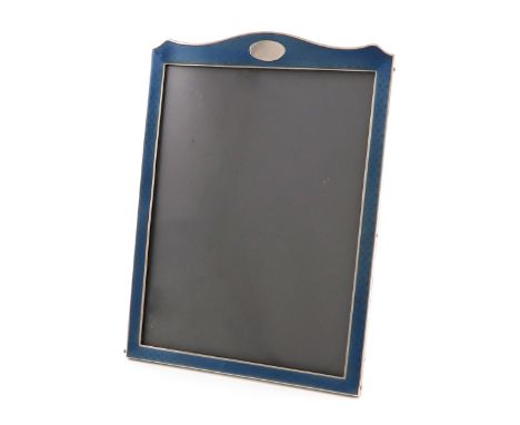 A silver and enamel photograph frame,by Sanders &amp; Mackenzie, Birmingham 1915,shaped rectangular form, with engine-turned 